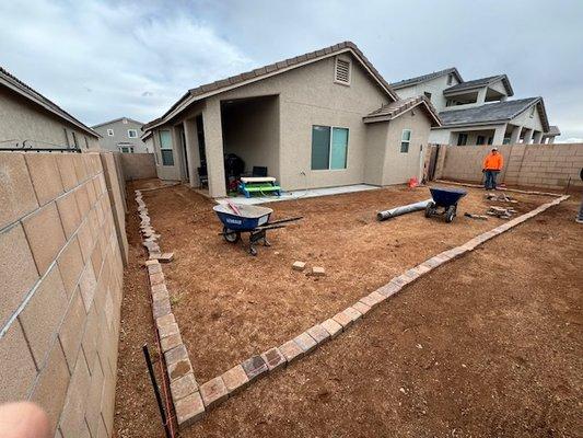 Prep phases of new paver border and turf