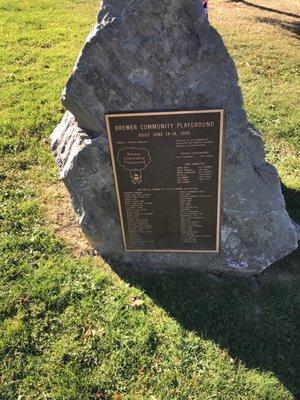 Plaque embedded on a large boulder at the main entrance