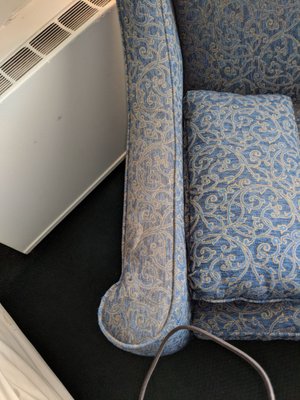 Greasy, dirty chair. Pillow shows what color the upholstery used to be Gross!