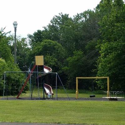 a small playground near the parking lot