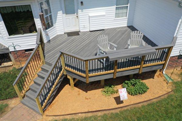 Trex Transcends deck with a built in bar top on the railing, perfect for enjoying the sunset.