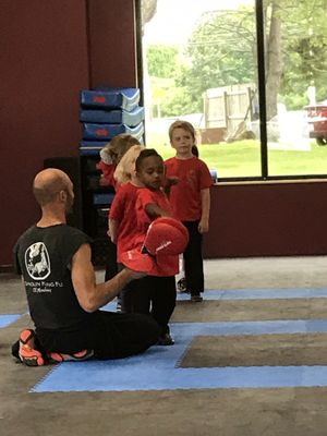 My son Sebastian at the little dragons class with Ras