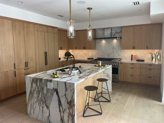 Rift white oak kitchen with Porcelain waterfall island