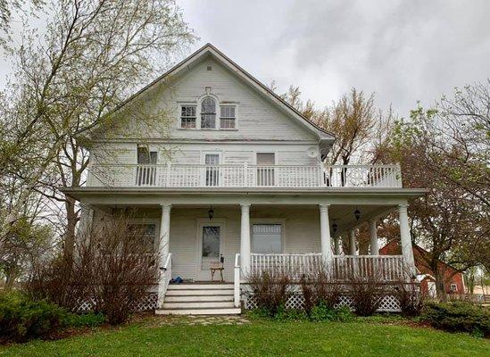 Before all wood trim around windows and porch