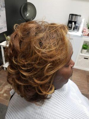 Hair color with highlights.