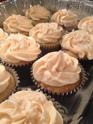 Vanilla Chai cupcake with raspberry buttercream frosting and coconut sprinkles