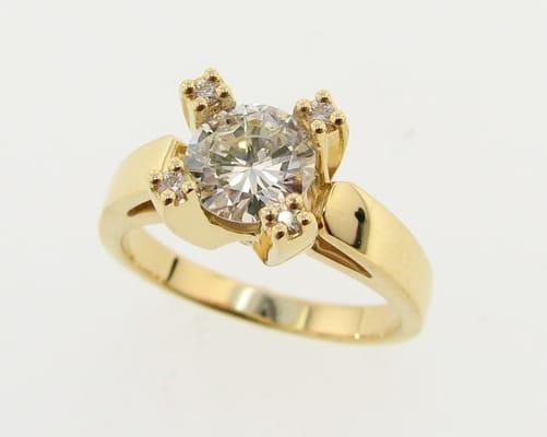 18K yellow gold setting with stones set in prongs.  Oh, the possibilities.