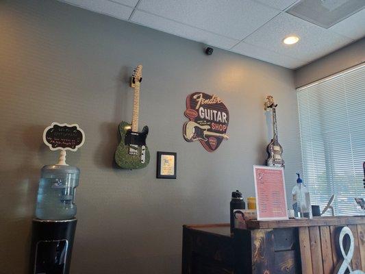 Cool looking drum and ukulele on the wall when you come in.