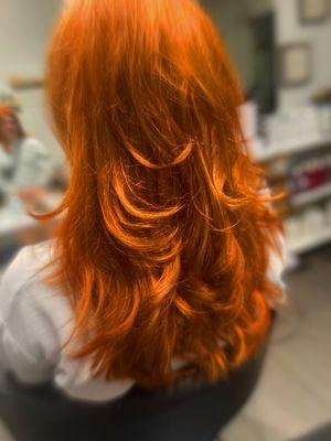 Bright copper/red color with butterfly  haircut