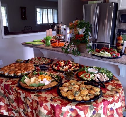 Chicken Salad Croissants, Fruit/Cheese Kebobs, Veggie Tray with Ranch, Tortellini Skewers, Mini Quiche, Fresh Fruit and Cheese and Crackers.