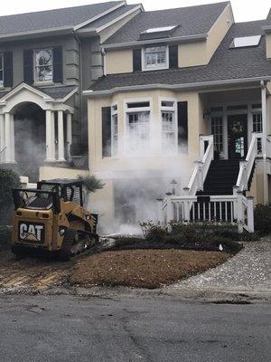 Dry cutting concrete releasing free silica to workers and neighborhood.   Silica is a carcinogen?