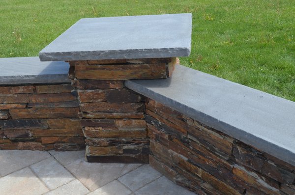 Sitting Wall, featuring natural stone facing with blue stone capping.