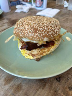 Bacon, egg, and cheese on a sesame seed bagel