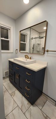 Second step in painting, painted and installed cabinet in the bathroom