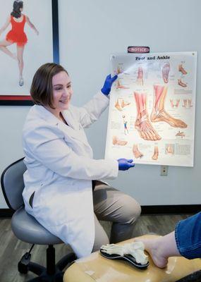 Dr. Hagmann explains foot anatomy to a patient.