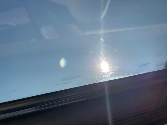 Vizion AutoSports - Bubbles in the roof tint, gaps in the edges, and loose tint hanging down.