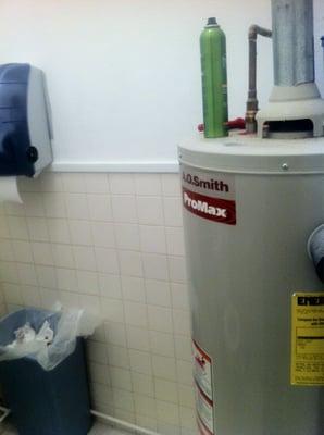 Hairspray and hairbrush on top of dirty water heater. Hairspray?! Really?!