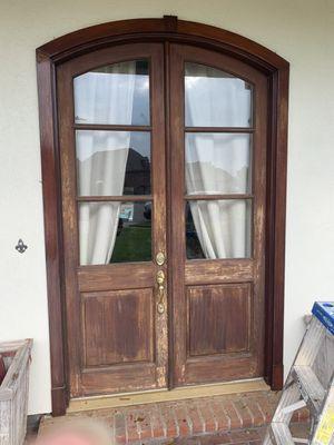 We specialize in staining and refinishing doors. (Before)