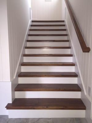 A photo of a recent set of stairs we built on Wing's Neck with Peter Coffin Builders.  Stairs were made of dark hickory floor...