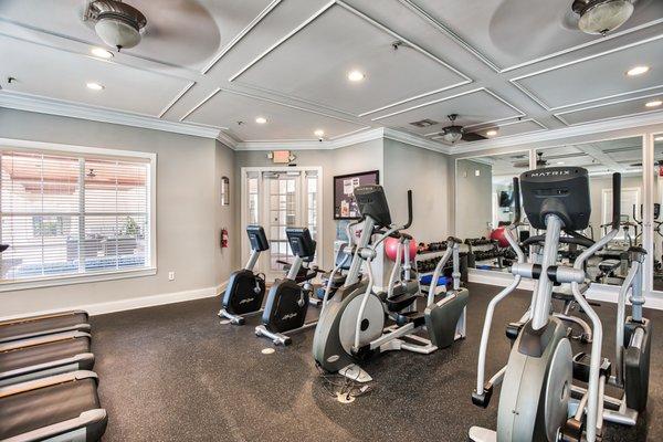 Fitness center features cardio & weight equipment