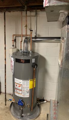 New gas water heater with standard piping reconstruction.