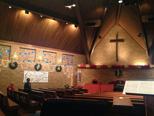 The front of the sanctuary decorated for Christmas.