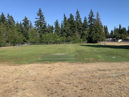 Playfield with soccer goals out.