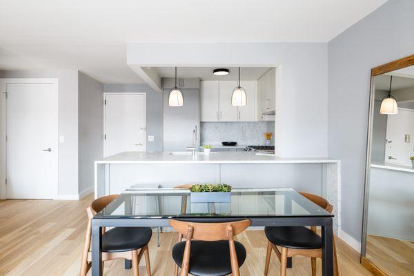 A spacious kitchen and dining area in a Fifth Avenue condo: http://bit.ly/2FEzBTU