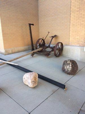 Old hay mower out front