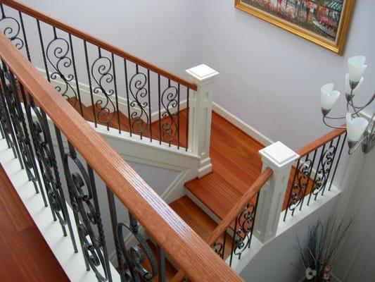 Metal and wood railings, solid wood treads and risers, custom posts.