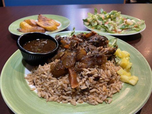 Stewed meat over beans and rice w/ fresh pineapple. Side salad with a sweet vinaigrette dressing, and caramelized plantains.