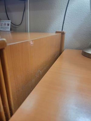 Table under TV. Smear of something and more dust.