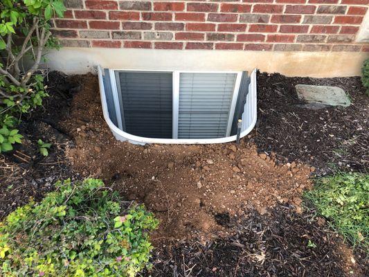 This is a finished well.  We can work around most of your bushes and sprinkler boxes.