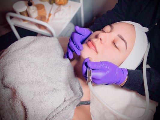 Deep cleaning facial with a microdermabrasion service.