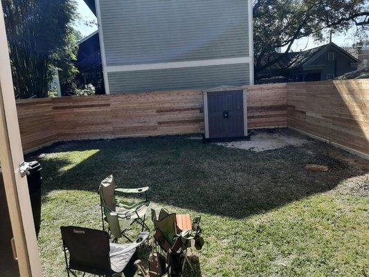 Horizontal cedar fence, 7 ft. tall, before stain.