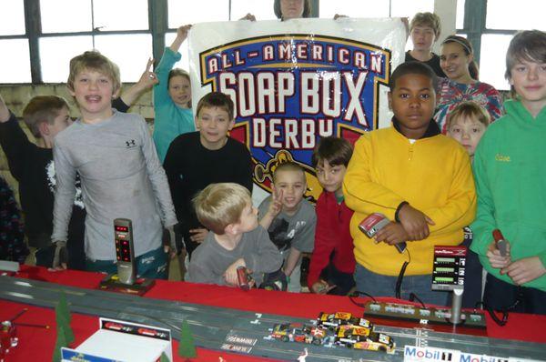 Joel with his race track at Soap Box Derby Event