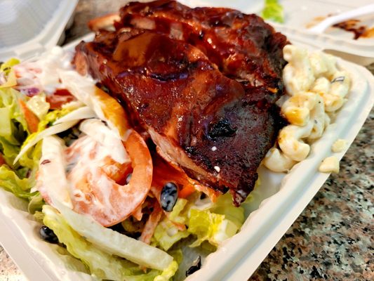 Ribs, resting on a Green and Mac Salad