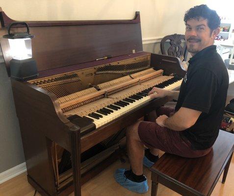 Frank cleaning and tuning our 1948 piano! Ver professional and pleasant technician