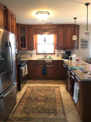 Before photo. Update your kitchen with cabinet refinishing and a color change.