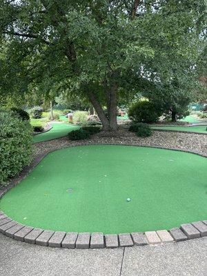 Miniature golf the practice hole before you start.