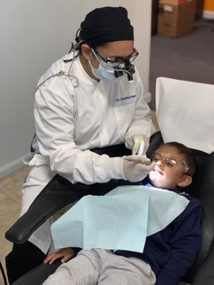 A very comfortable 3 year old getting his cleaning done with Dr. Naqvi.