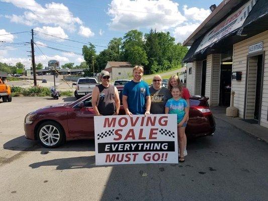 Me and my family after purchasing a2010 Nissan Altima, my first car.