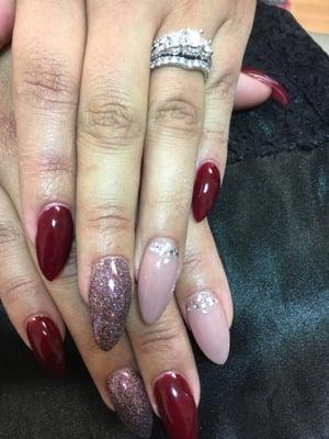 Gel over acrylic. Stilettos with glitter and rhinestones.