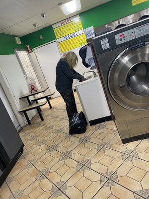 Homeless washing her dirty clothes in the sink, water was black and nasty smelled like cheese