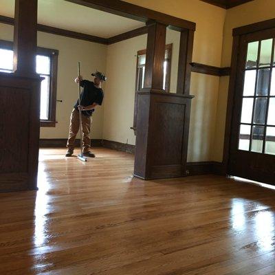 Justin is applying the fume-less water based finish to the oak floors he and Tray had just refinished.