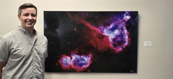 Our CEO and his first large format fine print of one of his images of deep space