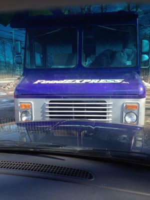 Look for the purple truck.