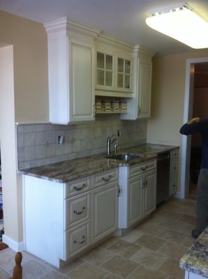 After picture of kitchen demo angle 2, dishwasher granite countertops.