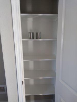 Interior painting of closet and added shelves in closet.Ask for more Shelving space for extra room for groceries.