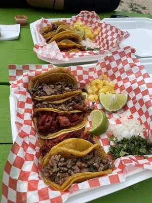 Tacos de carne asada and adobaba with piña on the side